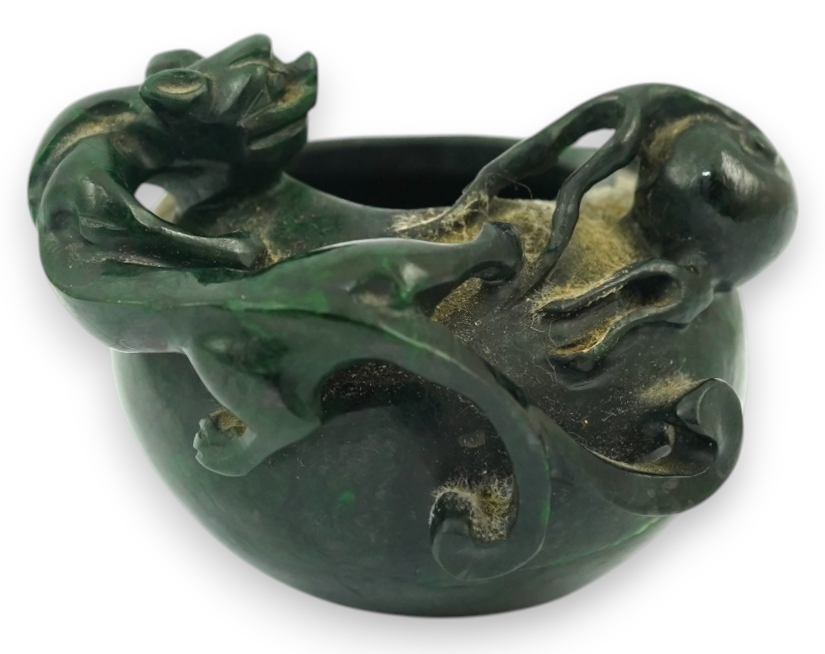 A Chinese dragon carved green hardstone brushwasher, 5cm high. Condition - good